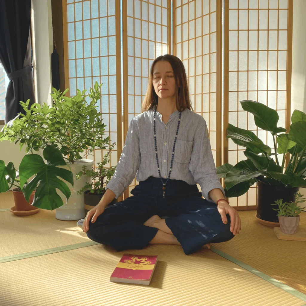 woman is meditating on the cushion meditation journal journalling