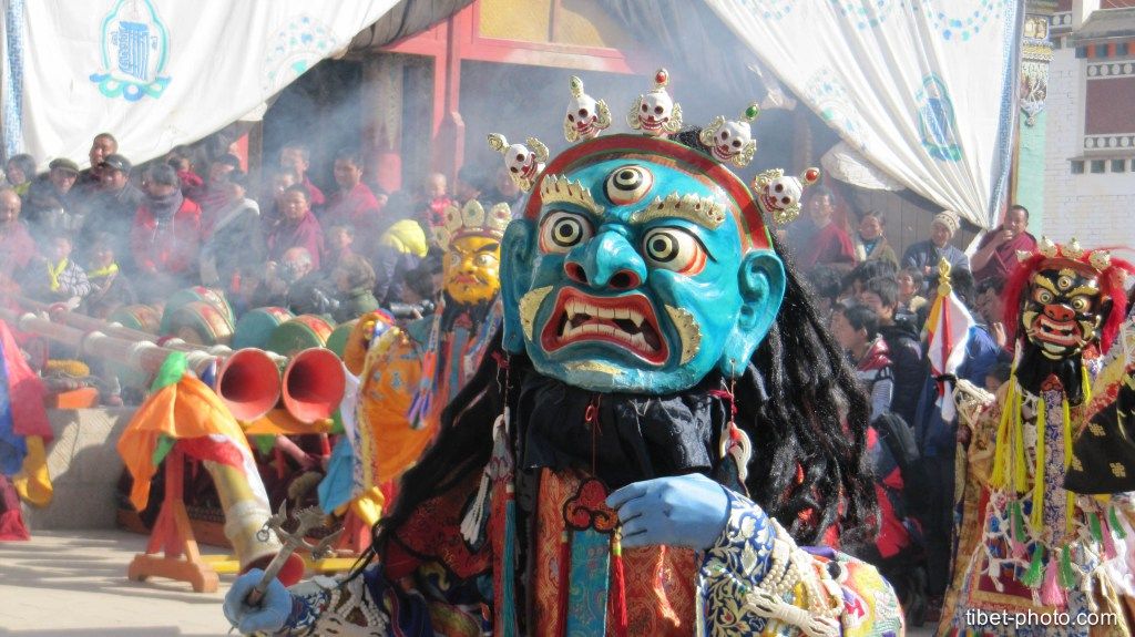 blue mask of tsam chan dance of tibetan buddhism highly religious text that came from an ancient religion Bön